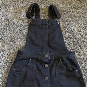 Black overall skirt with buttons